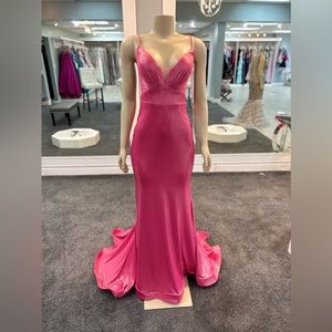 Size 10. fuchsia  color. trumpet cut. crisscross back. v neckline plunge